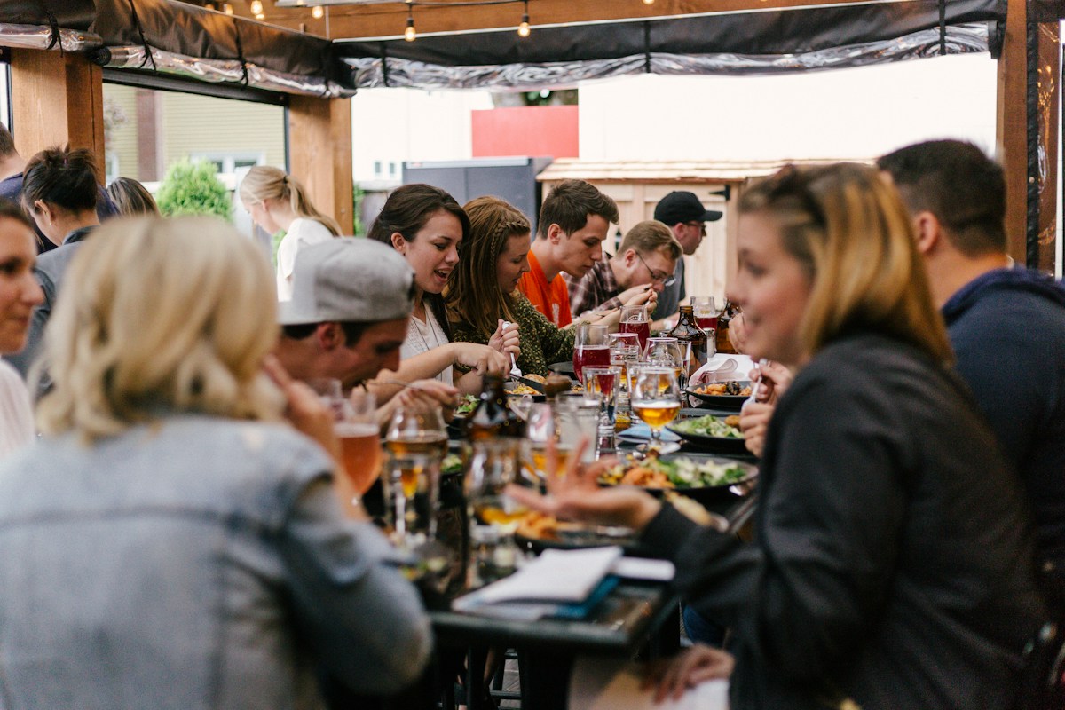 Guests sharing a meal at a restaurant event